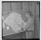 Highway patrolman showing a map